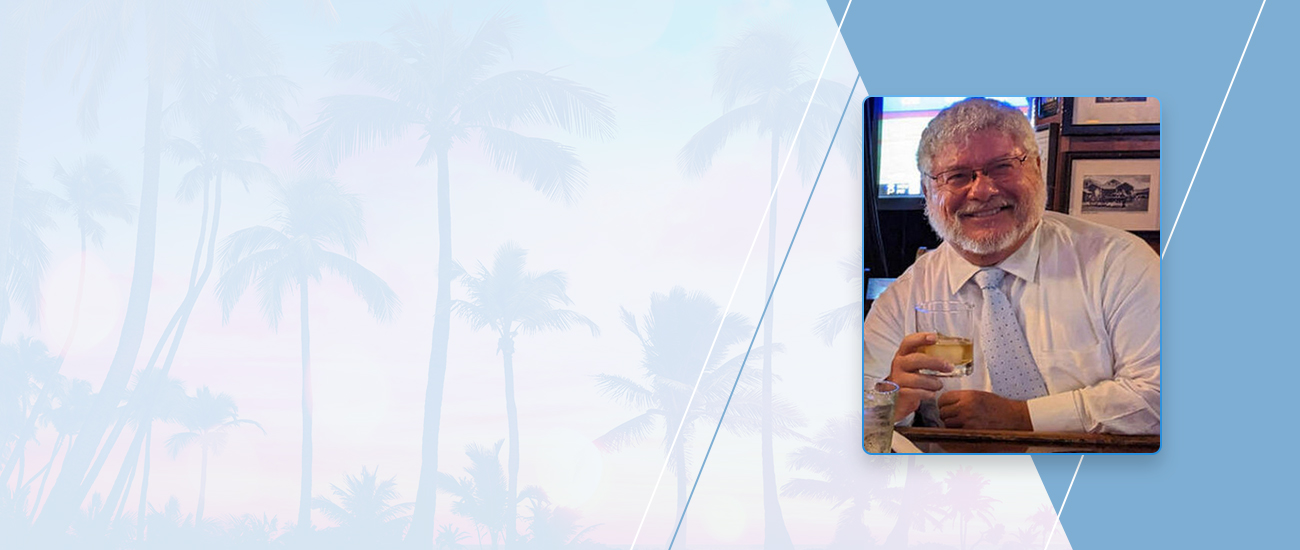 Attorney Michael Jeffrey Kessle with palm tree artwork in the background